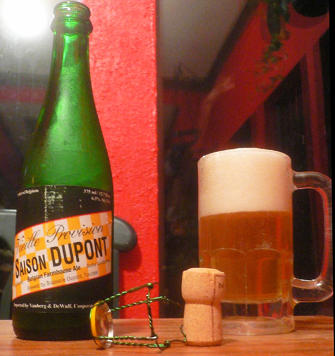 A bottle of Saison Dupont and glass