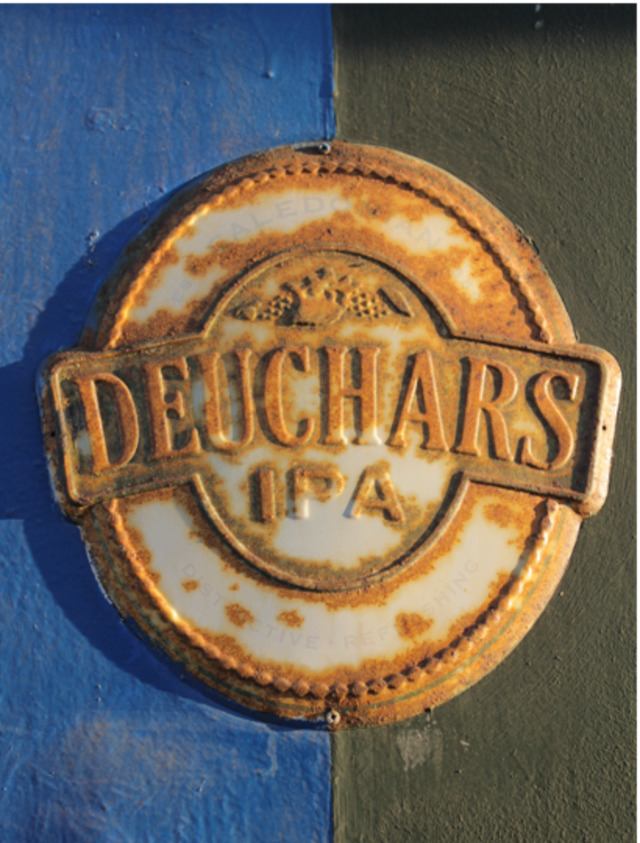 Old promtional Deuchars IPA sign on a 19th century pub on Leith Walk