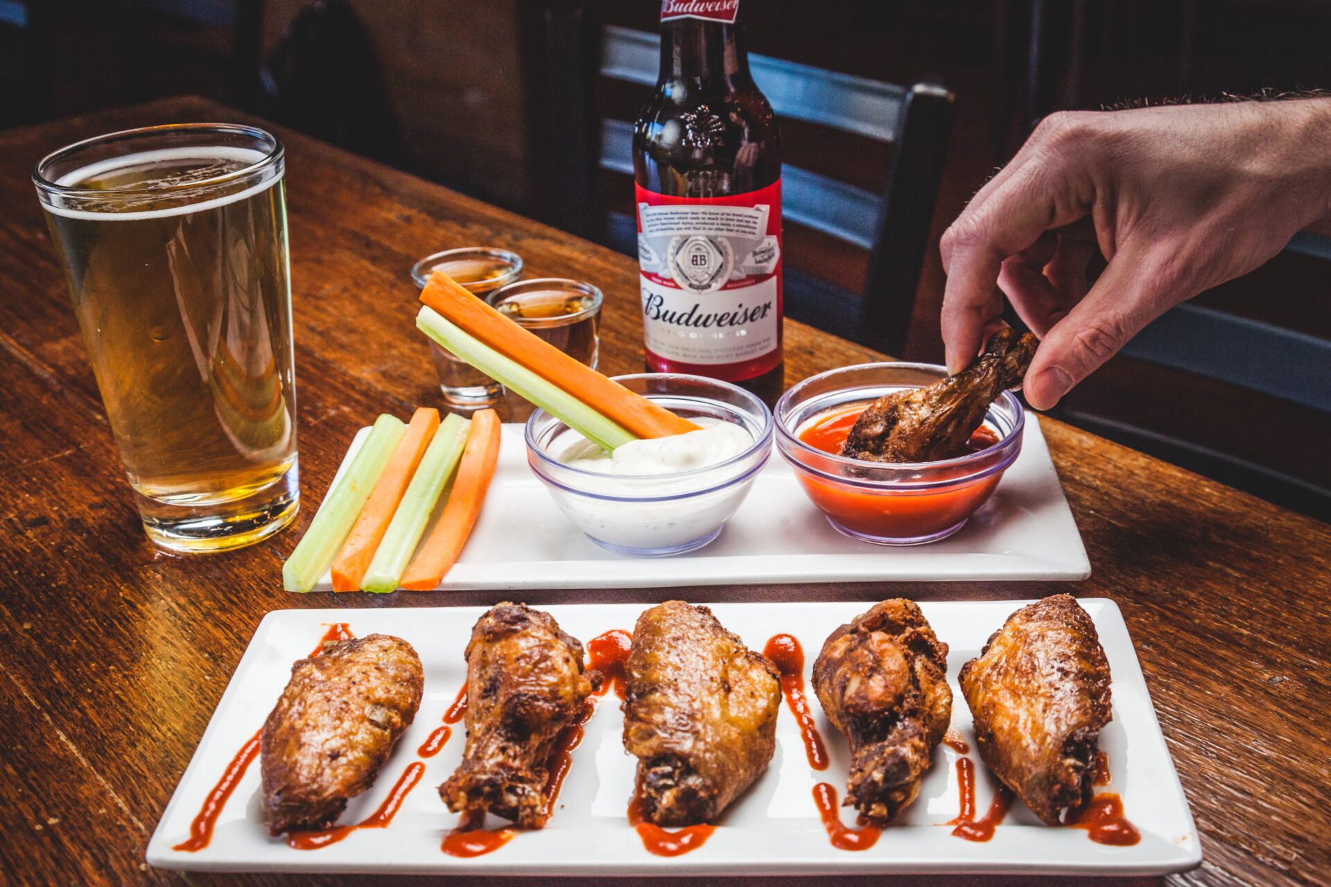 fried chicken and beer on the wooden table