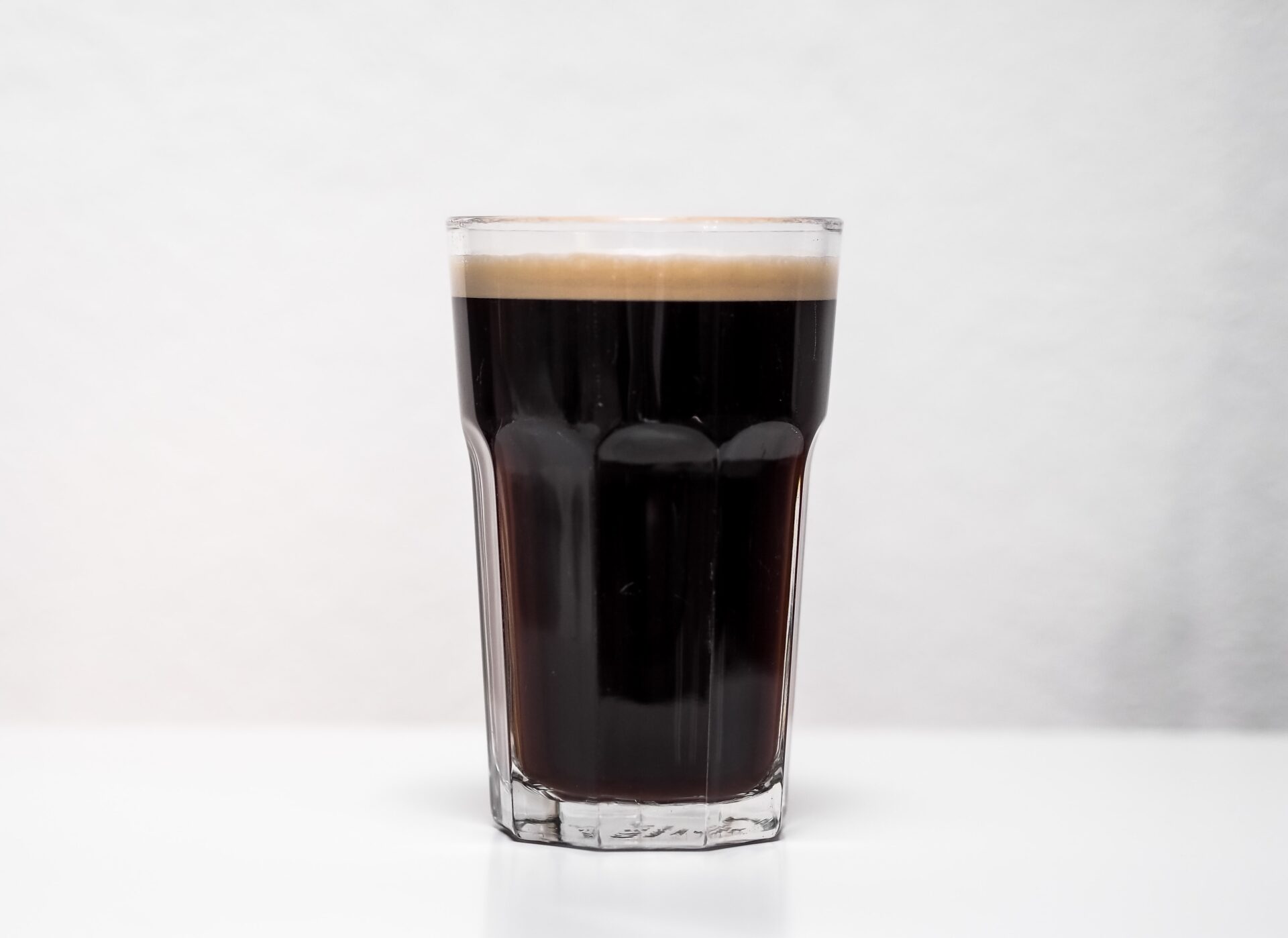clear drinking glass with dark beer