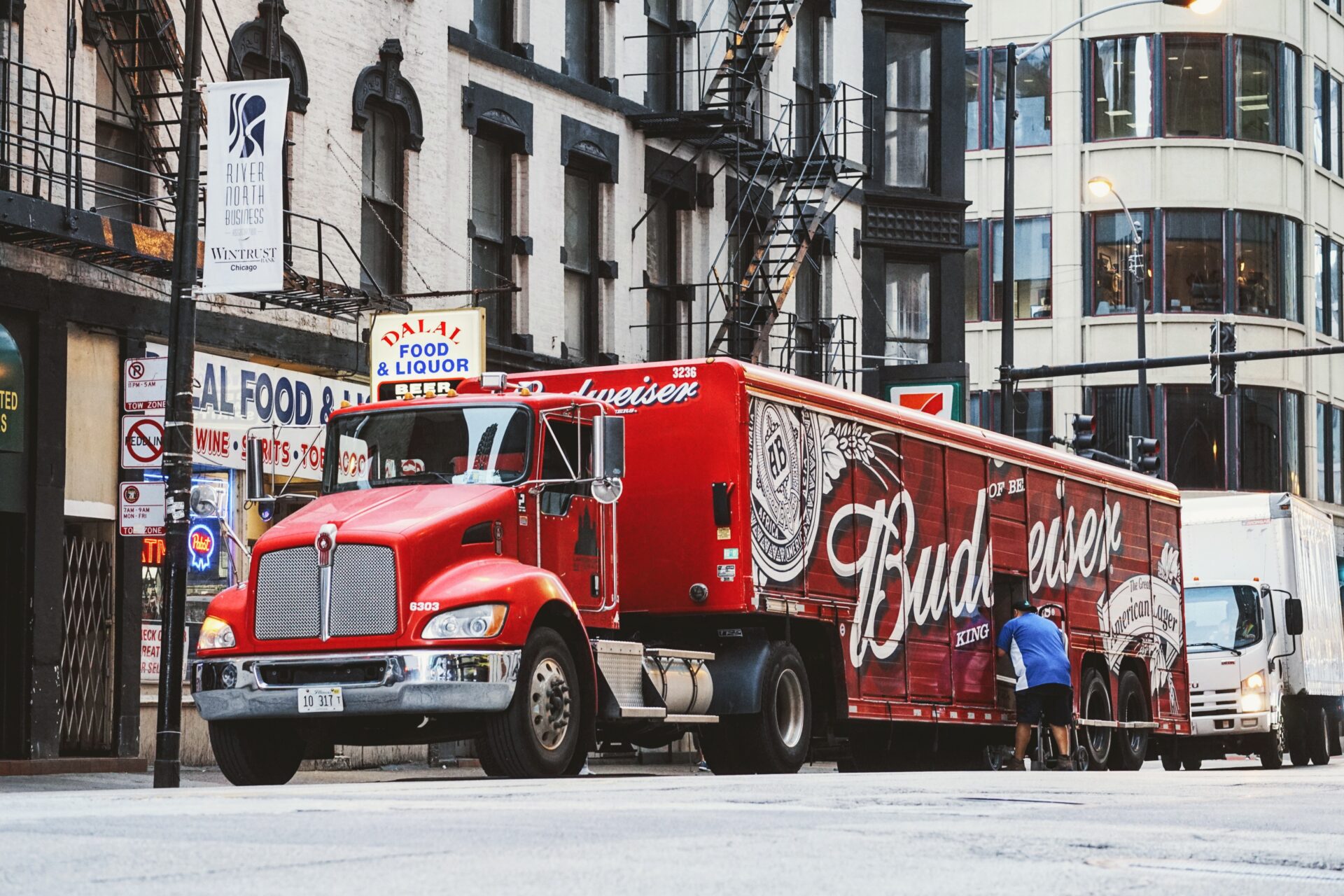 the truck is painted in red with the emblem and the name of the beer: Budweiser beer